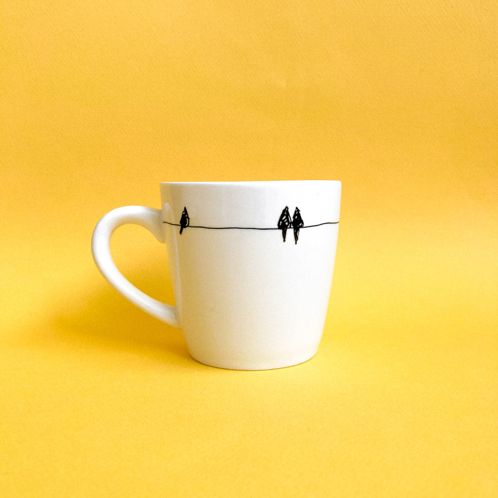 Tasse avec petits oiseaux